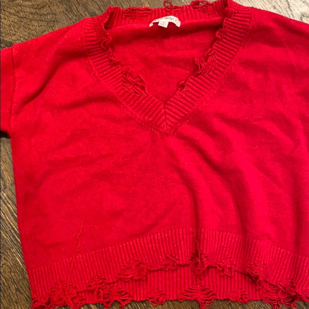 red ripped sweater